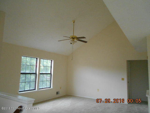 709 Ivy Court Jackson, NJ 08527 - Photo 2 of 8 an empty room with windows