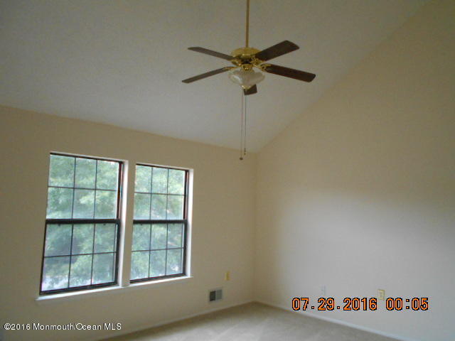 709 Ivy Court Jackson, NJ 08527 - Photo 3 of 8 a view of an empty room with a window