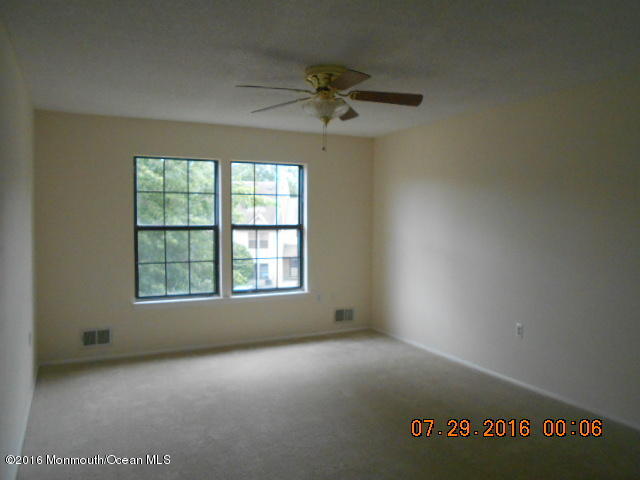709 Ivy Court Jackson, NJ 08527 - Photo 5 of 8 an empty room with a window