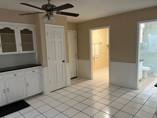a view of an entryway with wooden floor