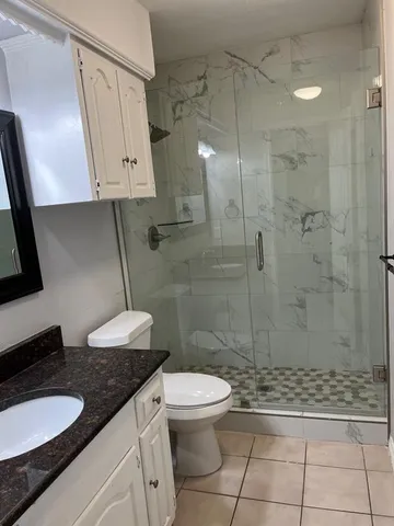 wooden floor in an empty room with a fireplace