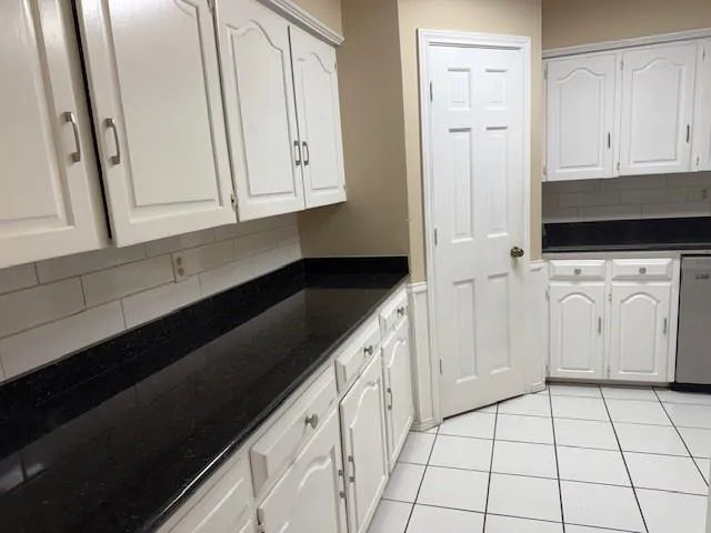 a view of a kitchen with a sink and dishwasher