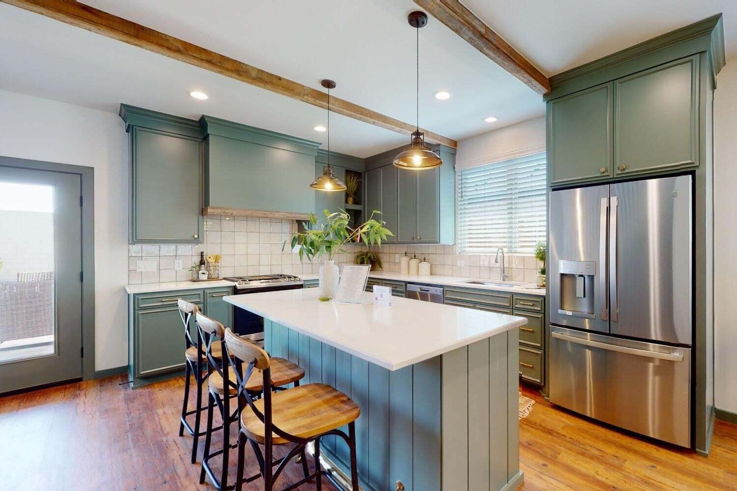 3617 128th Street Lubbock, TX 79423 - Photo 6 of 30 a kitchen with stainless steel appliances a refrigerator and a table