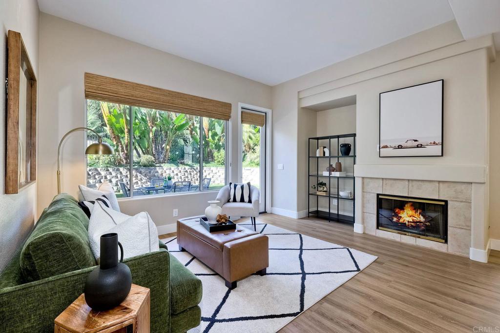 7165 Willet Circle Carlsbad, CA 92011 - Photo 11 of 65 a living room with furniture fireplace and window