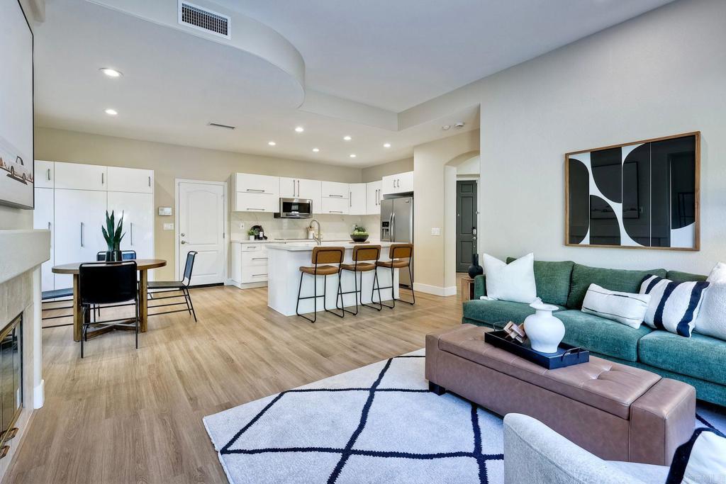 7165 Willet Circle Carlsbad, CA 92011 - Photo 13 of 65 a living room with furniture and kitchen view