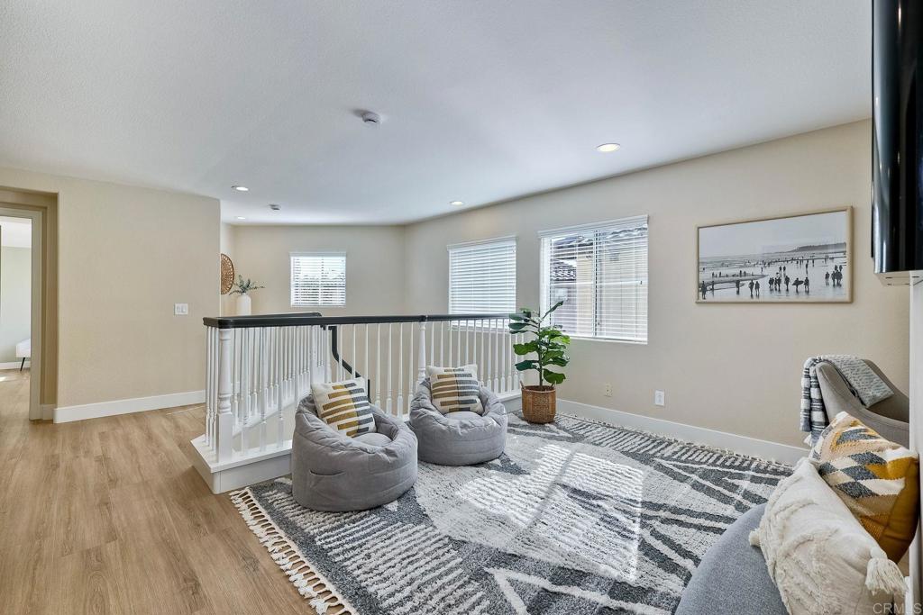 7165 Willet Circle Carlsbad, CA 92011 - Photo 19 of 65 a living room with furniture and wooden floor