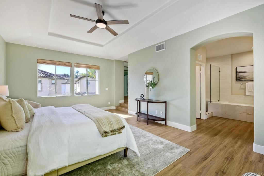 7165 Willet Circle Carlsbad, CA 92011 - Photo 21 of 65 a bedroom with a bed and a table