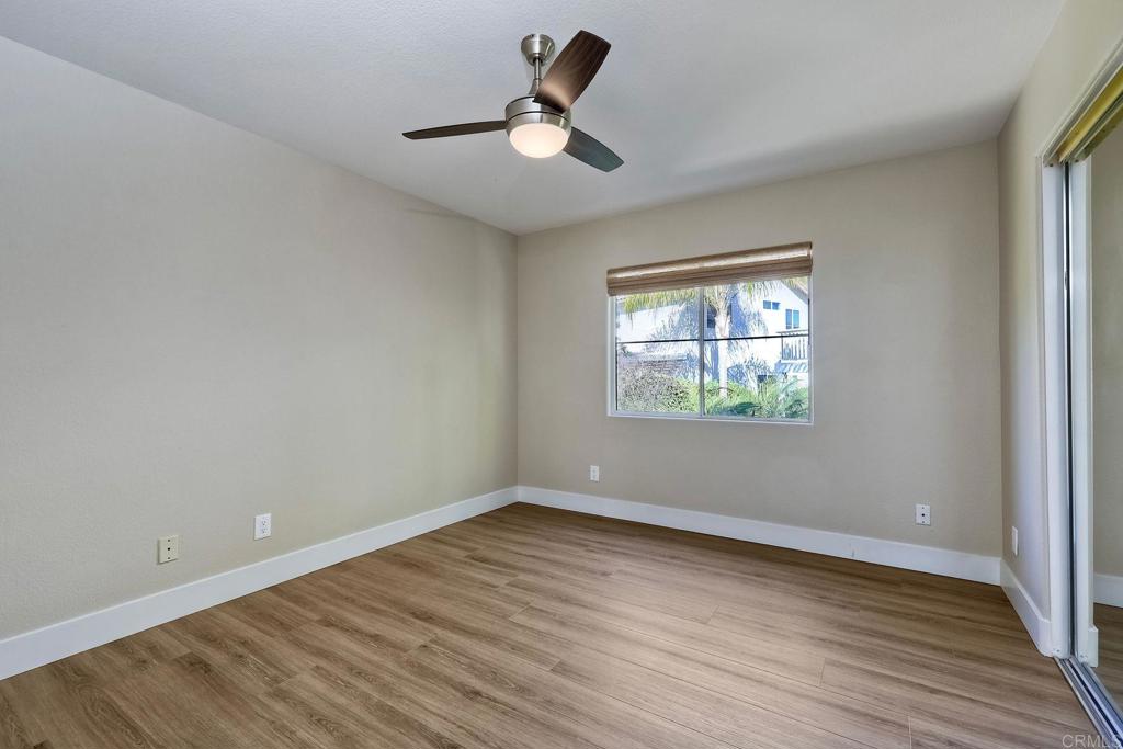 7165 Willet Circle Carlsbad, CA 92011 - Photo 29 of 65 wooden floor in an empty room with a window