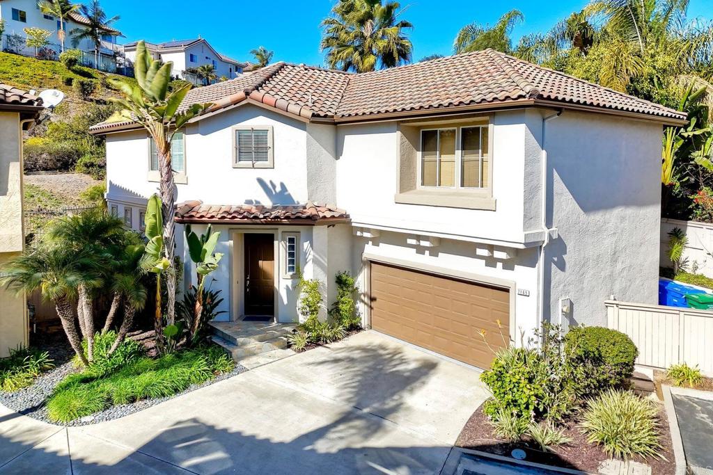 7165 Willet Circle Carlsbad, CA 92011 - Photo 44 of 65 a front view of a house with garden