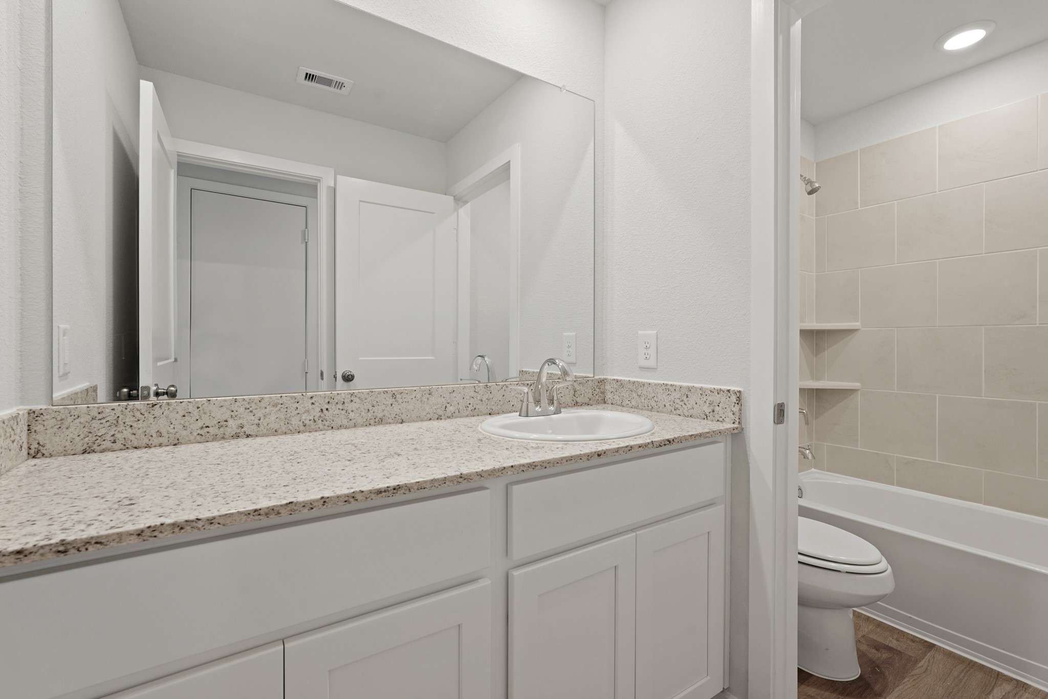 17202 King Eider Road Waller, TX 77484 - Photo 15 of 29 a bathroom with a granite countertop sink toilet and shower