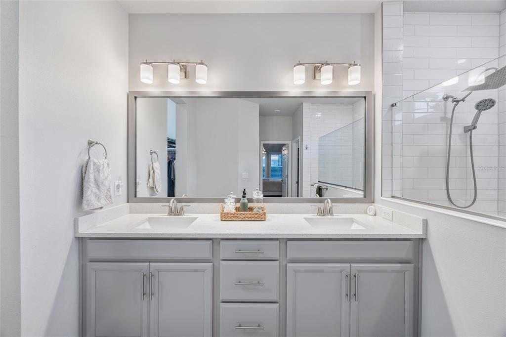 11720 Chevelon Lane Parrish, FL 34219 - Photo 12 of 70 a bathroom with sinks vanity and a mirror