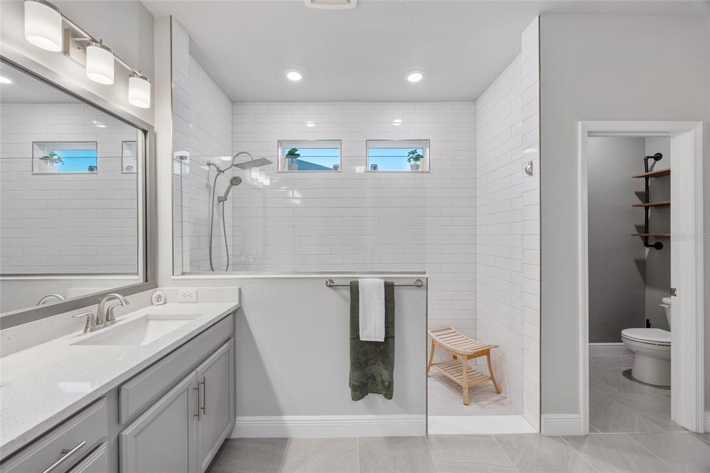 11720 Chevelon Lane Parrish, FL 34219 - Photo 13 of 70 a bathroom with a sink and a mirror