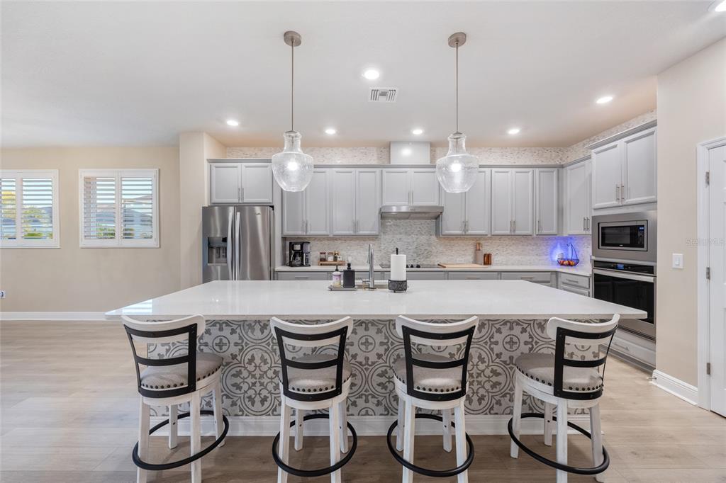 11720 Chevelon Lane Parrish, FL 34219 - Photo 16 of 70 a kitchen with counter space cabinets and appliances