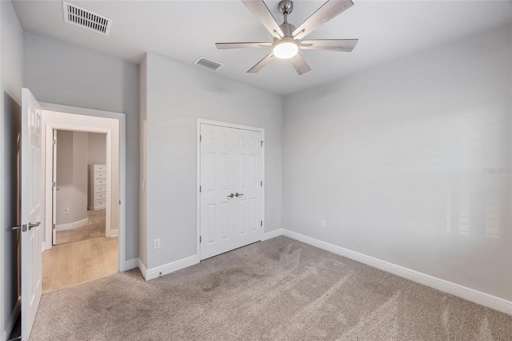 11720 Chevelon Lane Parrish, FL 34219 - Photo 21 of 70 an empty room with a ceiling fan and a window