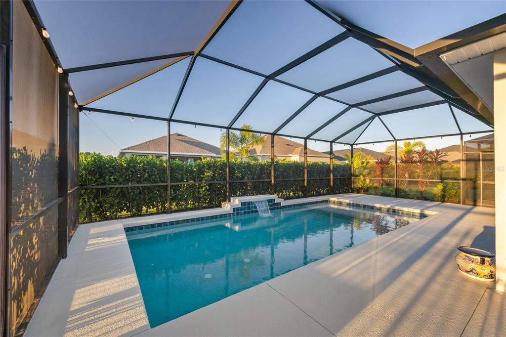 11720 Chevelon Lane Parrish, FL 34219 - Photo 27 of 70 a view of a patio with a table and chairs under an umbrella