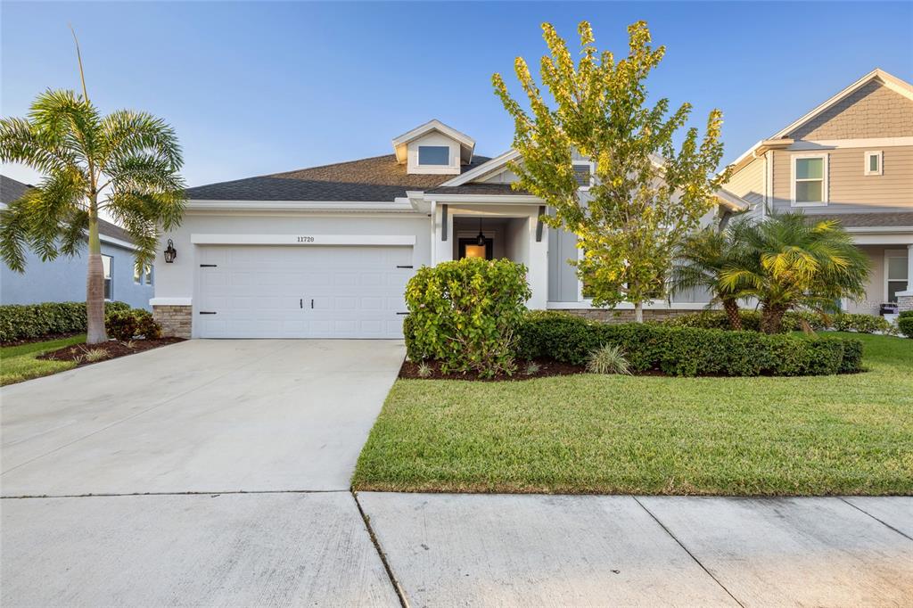 11720 Chevelon Lane Parrish, FL 34219 - Photo 31 of 70 front view of a house with a yard