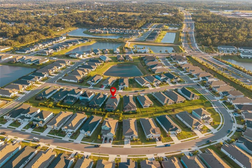 11720 Chevelon Lane Parrish, FL 34219 - Photo 36 of 70 an aerial view of a swimming pool with a city view