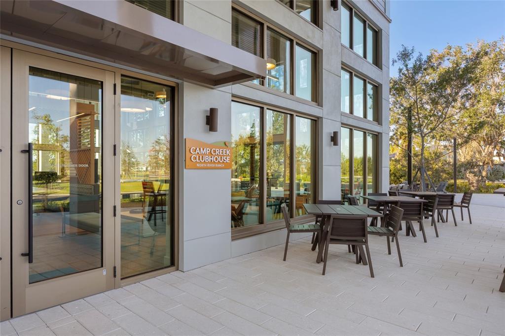 11720 Chevelon Lane Parrish, FL 34219 - Photo 52 of 70 a view of a building with dining table and chairs
