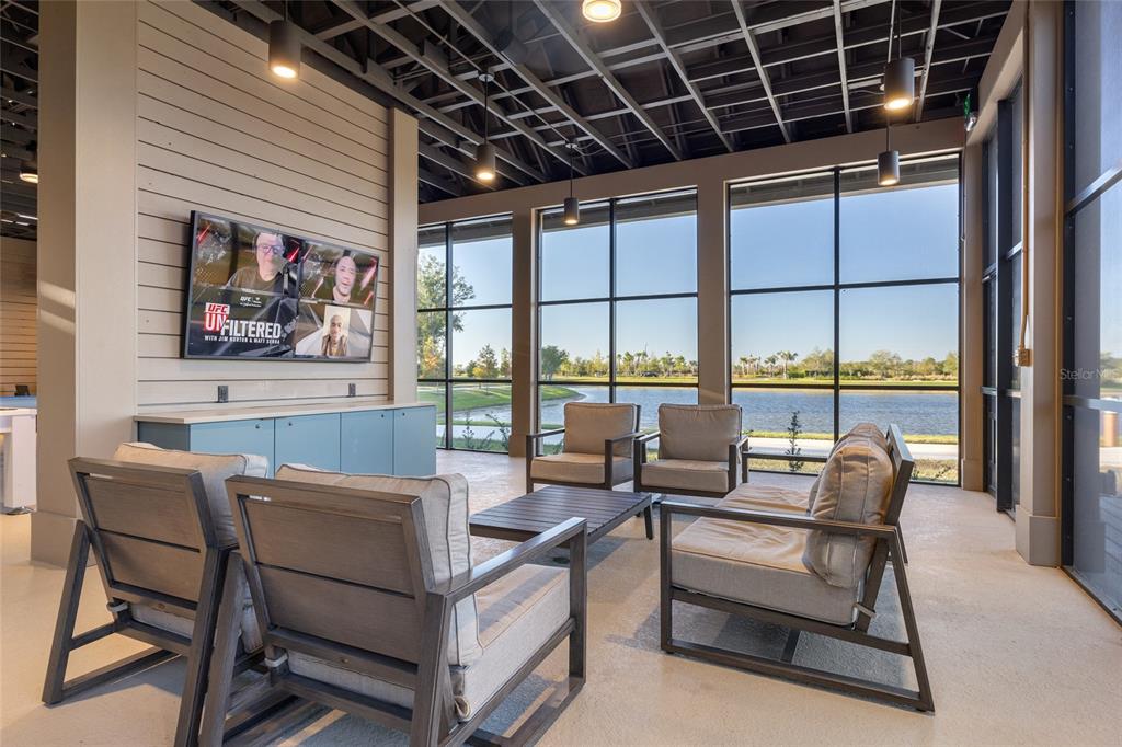 11720 Chevelon Lane Parrish, FL 34219 - Photo 56 of 70 a living room with furniture a large window and a rug