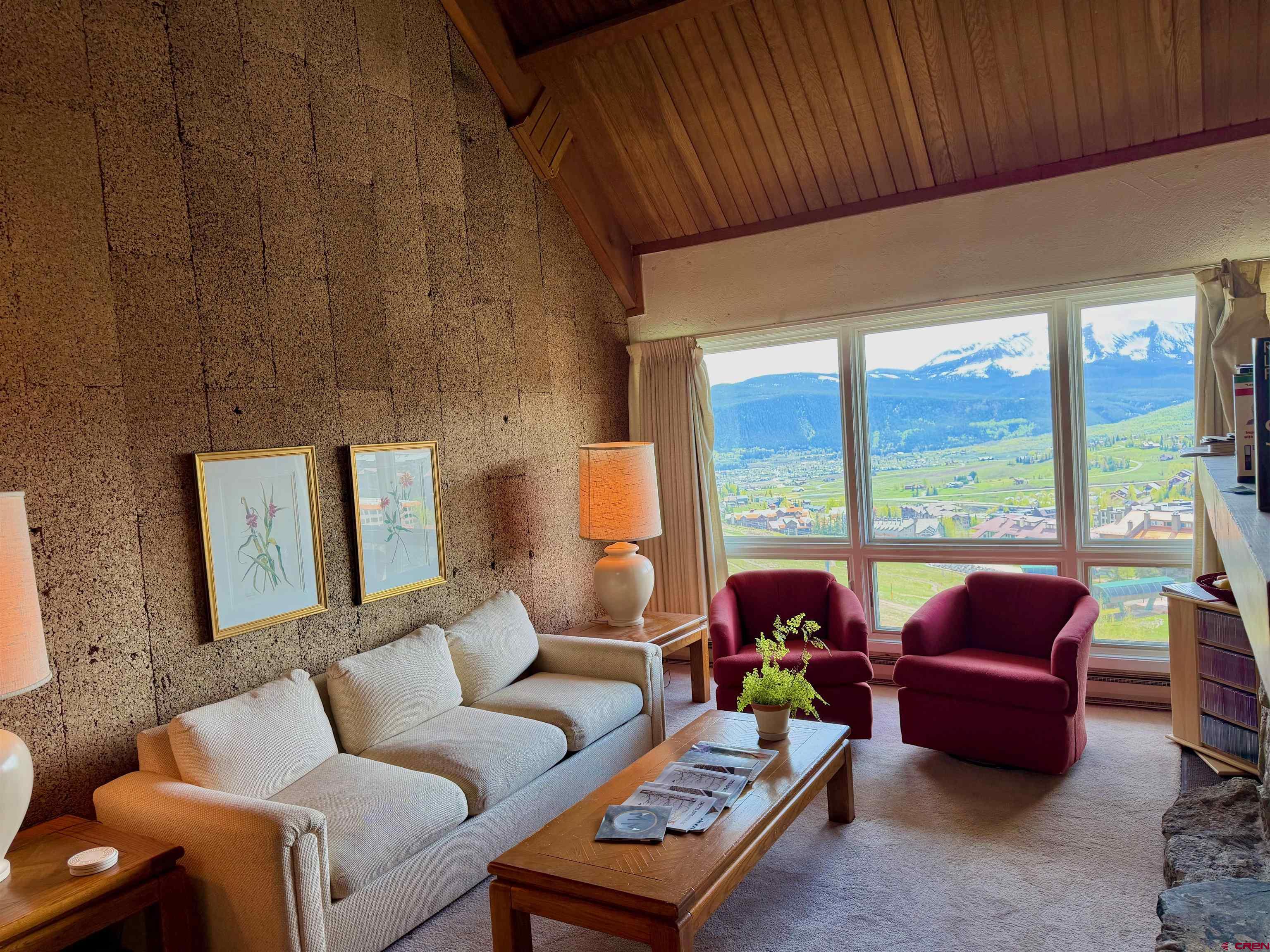 51 Whetstone Road, Unit 2306 Crested Butte, CO 81225 - Photo 7 of 44 a living room with furniture and a large window