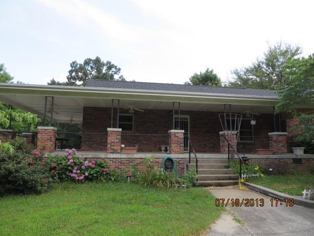 7737 Pinewood Road Primm Springs, TN 38476 - Photo 1 of 13 front view of house with a yard