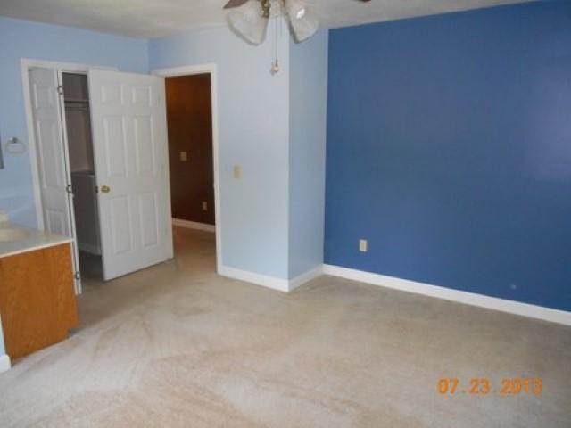 7737 Pinewood Road Primm Springs, TN 38476 - Photo 10 of 13 an empty room with closet