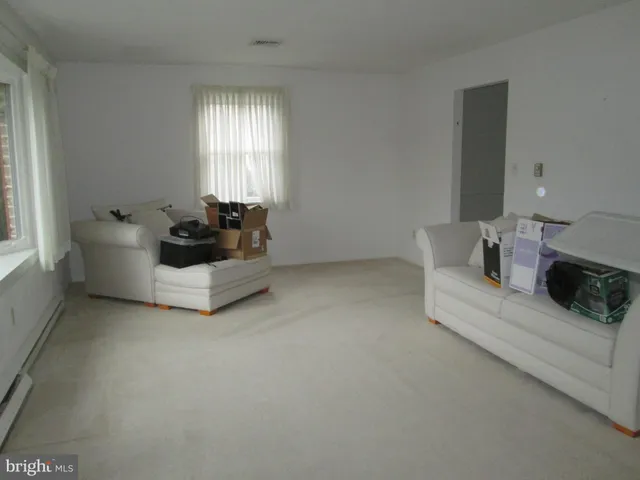 a living room with furniture and window