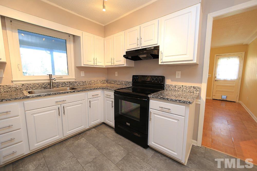 6628 Keystone Drive Raleigh, NC 27612 - Photo 11 of 28 Another view of the kitchen.