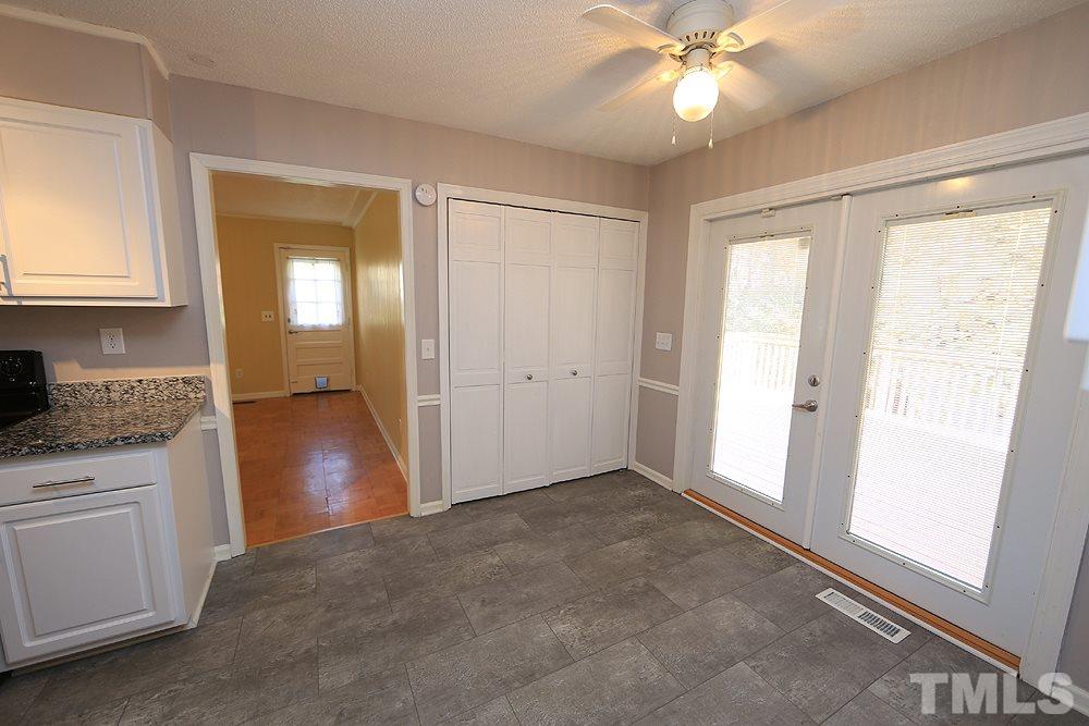 6628 Keystone Drive Raleigh, NC 27612 - Photo 13 of 28 New doors with built in blinds were added when windows were.