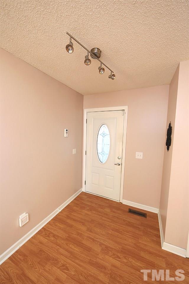 6628 Keystone Drive Raleigh, NC 27612 - Photo 4 of 28 Enter the home (there is a phantom screen on the front door) and the entry has a large coat closet and great space for furniture.