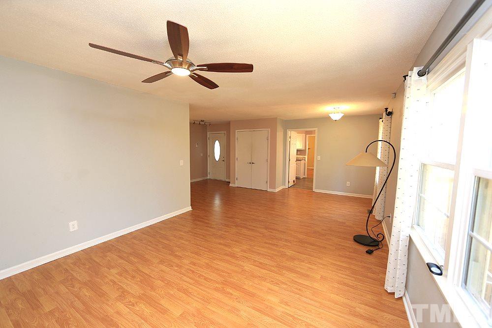 6628 Keystone Drive Raleigh, NC 27612 - Photo 6 of 28 A view of the dining and hall from the living room.
