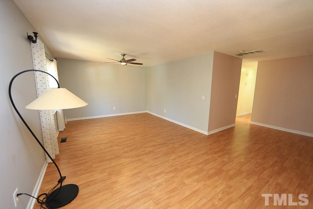 6628 Keystone Drive Raleigh, NC 27612 - Photo 8 of 28 A view of the living room from the dining area-not virtually staged