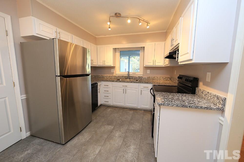 6628 Keystone Drive Raleigh, NC 27612 - Photo 10 of 28 The kitchen has been updated! Cabinets have been refaced, granite added, new hardware and flooring.