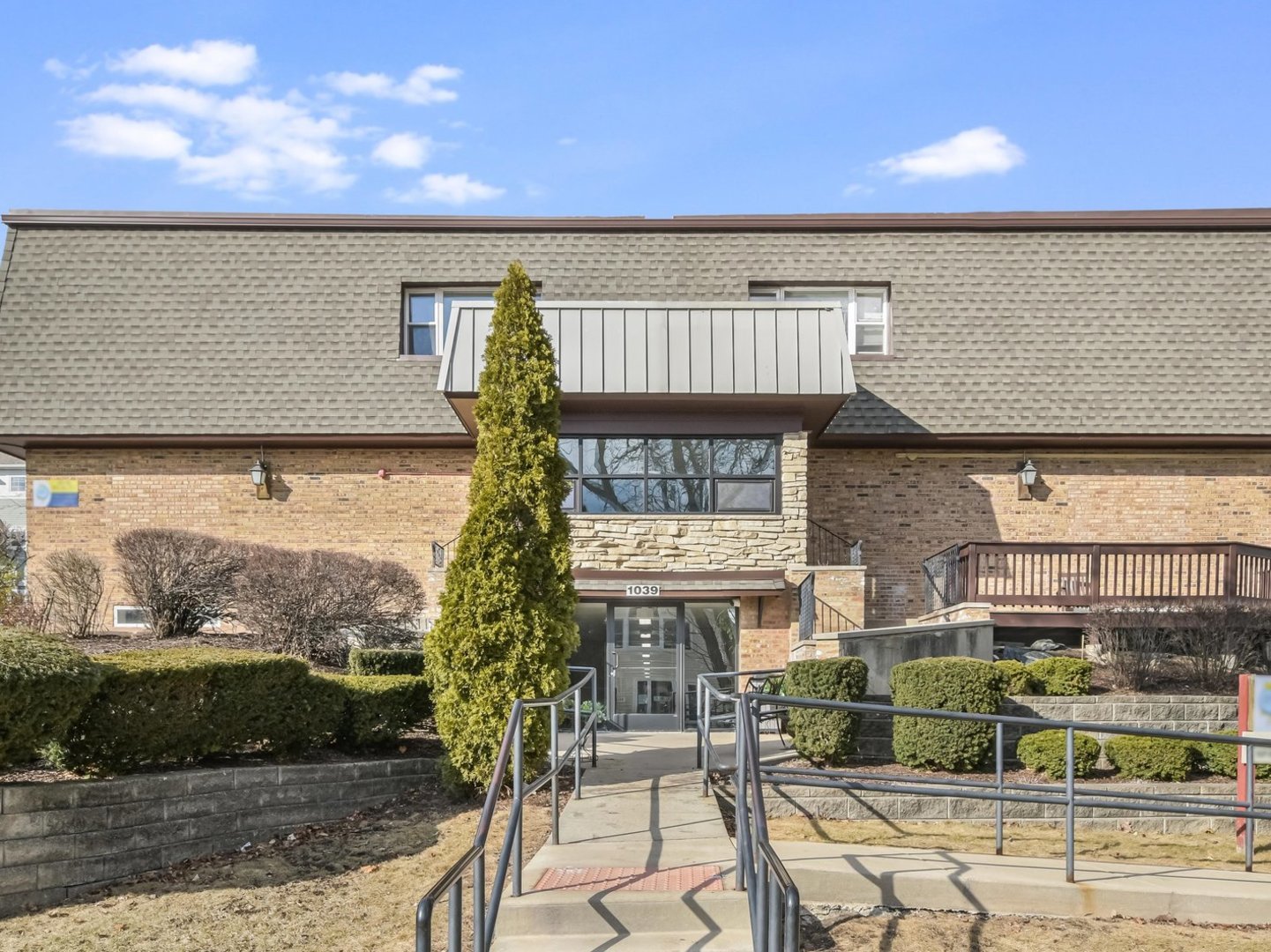 1039 College Avenue, Unit 10E Wheaton, IL 60187 - Photo 1 of 16 a view of house with outdoor space