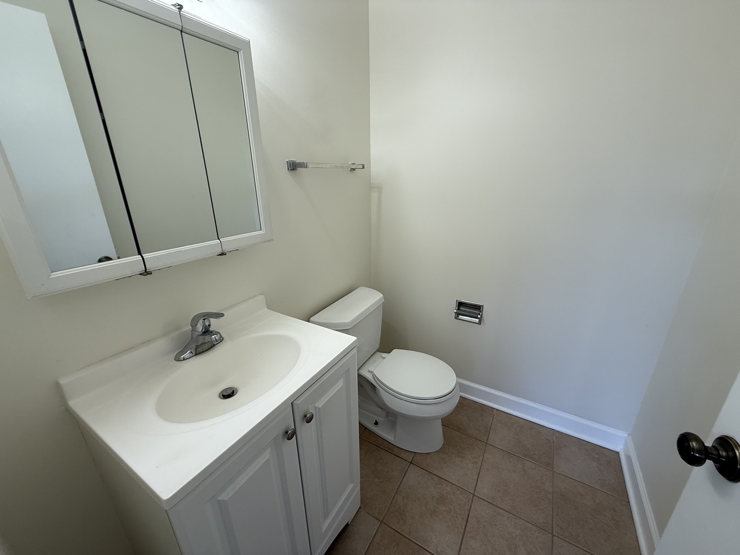 1039 College Avenue, Unit 10E Wheaton, IL 60187 - Photo 16 of 16 a bathroom with a sink toilet and vanity