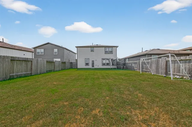 a big house with a big yard and large trees