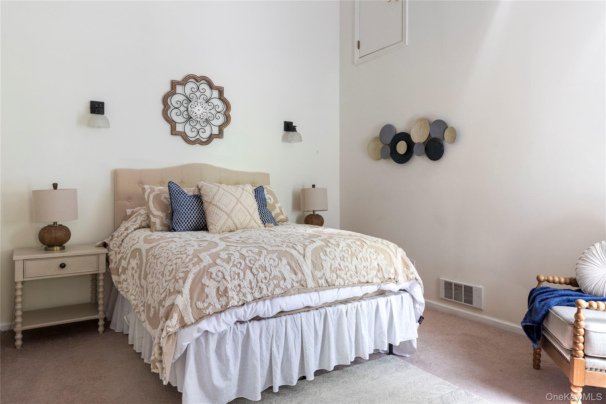 135 Turk Hill Road Brewster, NY 10509 - Photo 17 of 42 a bedroom with a bed and a chair