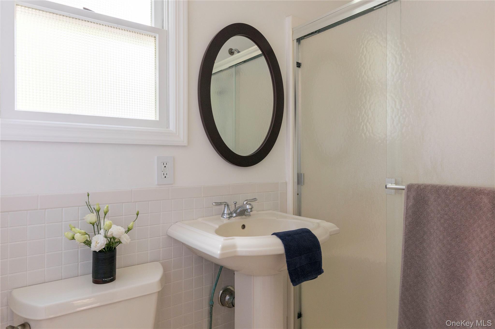 135 Turk Hill Road Brewster, NY 10509 - Photo 18 of 42 a bathroom with a sink and a mirror