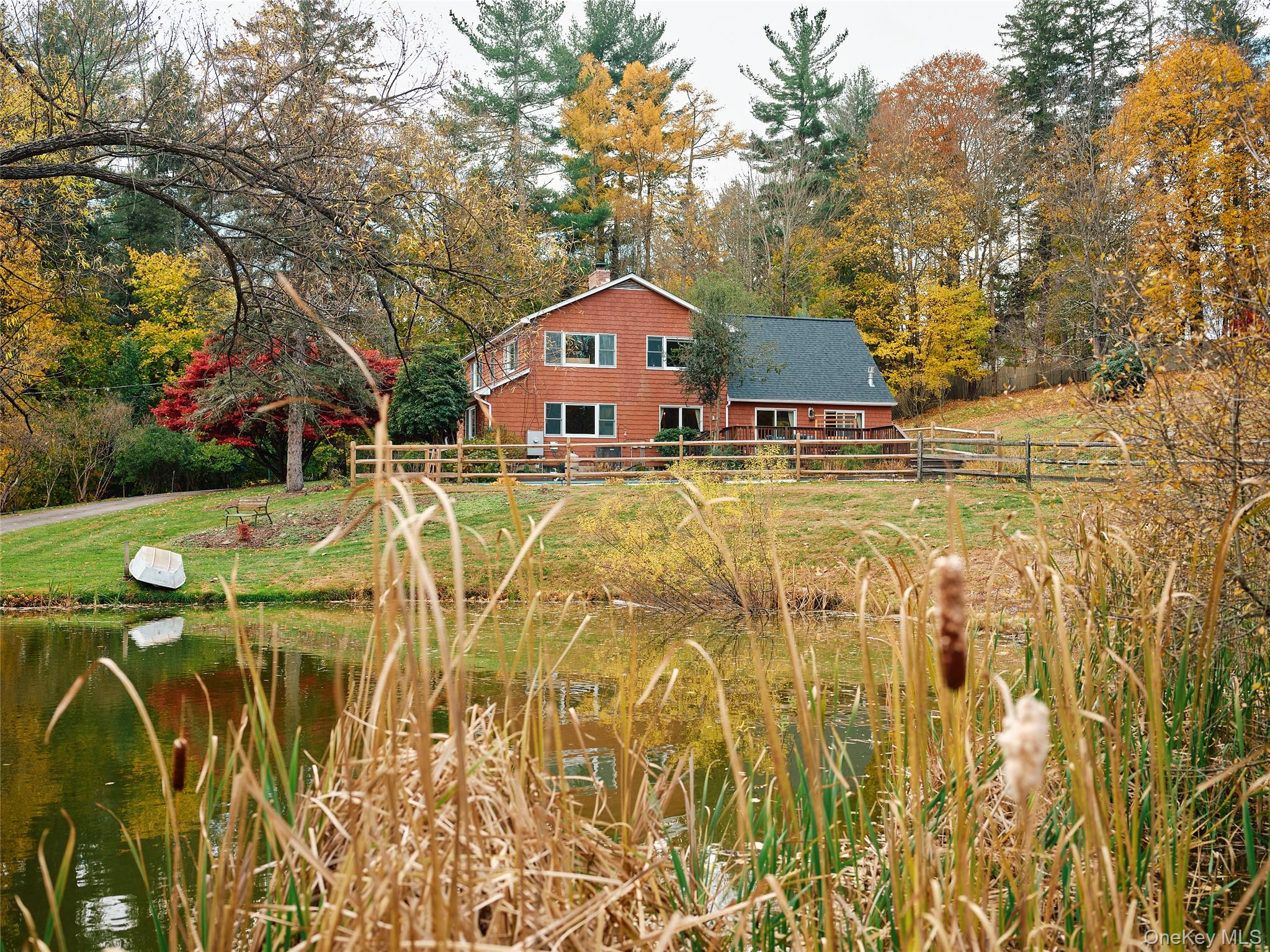 135 Turk Hill Road Brewster, NY 10509 - Photo 2 of 42 a aerial view of a house with swimming pool and sitting area