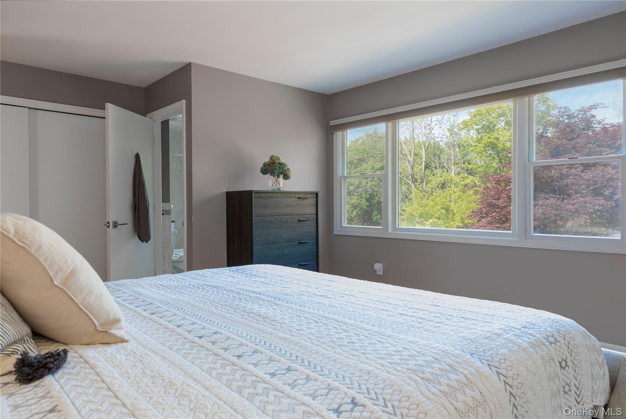 135 Turk Hill Road Brewster, NY 10509 - Photo 22 of 42 a bedroom with a large bed and a window
