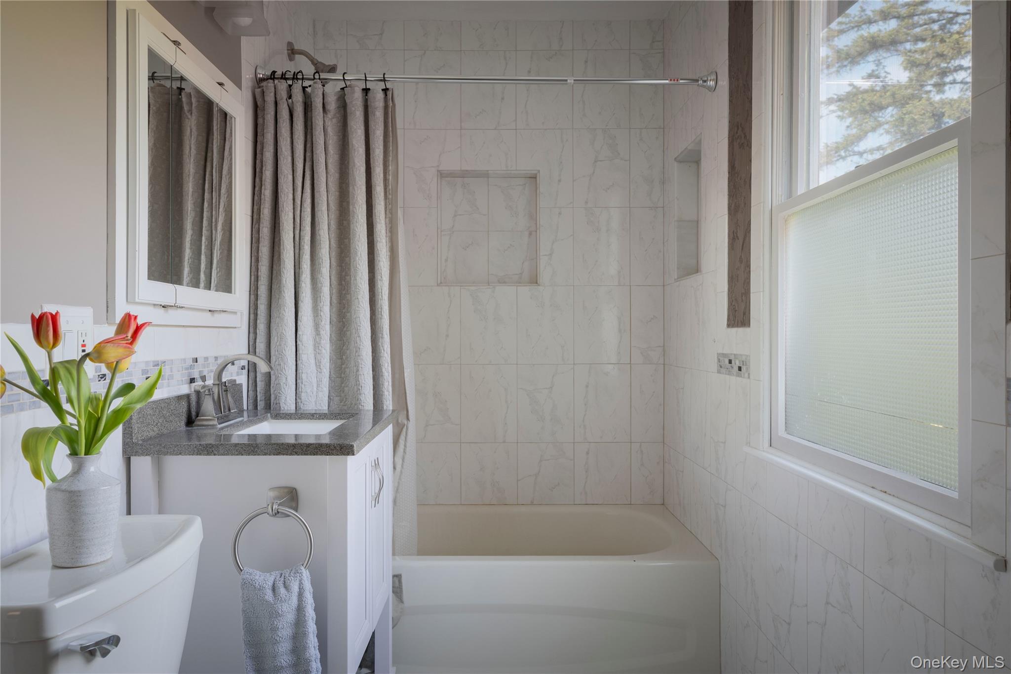 135 Turk Hill Road Brewster, NY 10509 - Photo 23 of 42 a bathroom with a sink a vanity and a mirror
