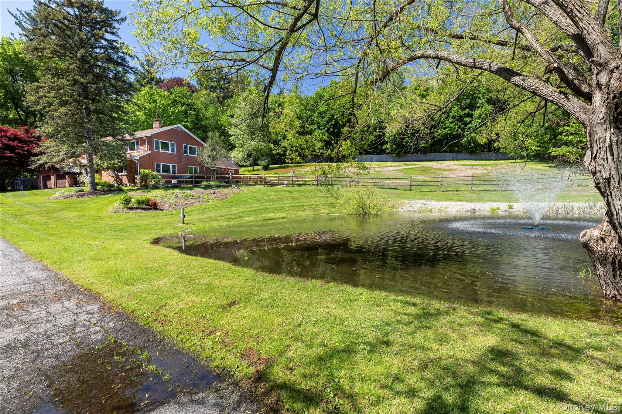 135 Turk Hill Road Brewster, NY 10509 - Photo 32 of 42 a view of a yard with a tree
