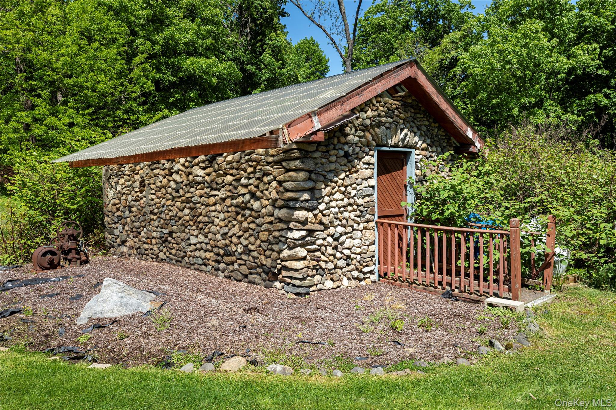 135 Turk Hill Road Brewster, NY 10509 - Photo 33 of 42 a view of a house with a yard and plants