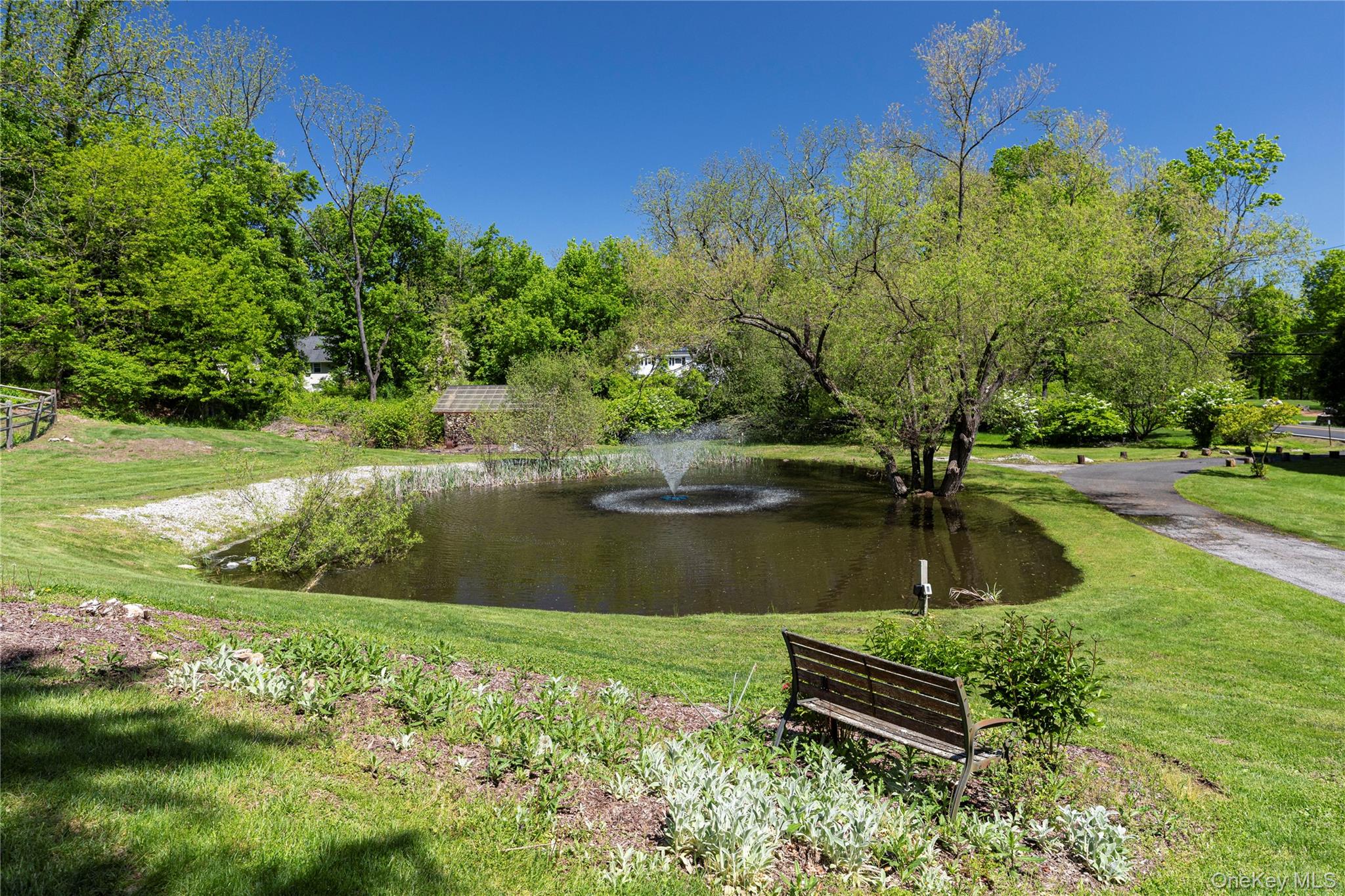 135 Turk Hill Road Brewster, NY 10509 - Photo 36 of 42 a view of a lake with a yard