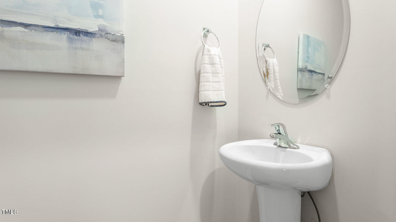219 Perseus Street Angier, NC 27501 - Photo 12 of 27 a bathroom with a sink and mirror