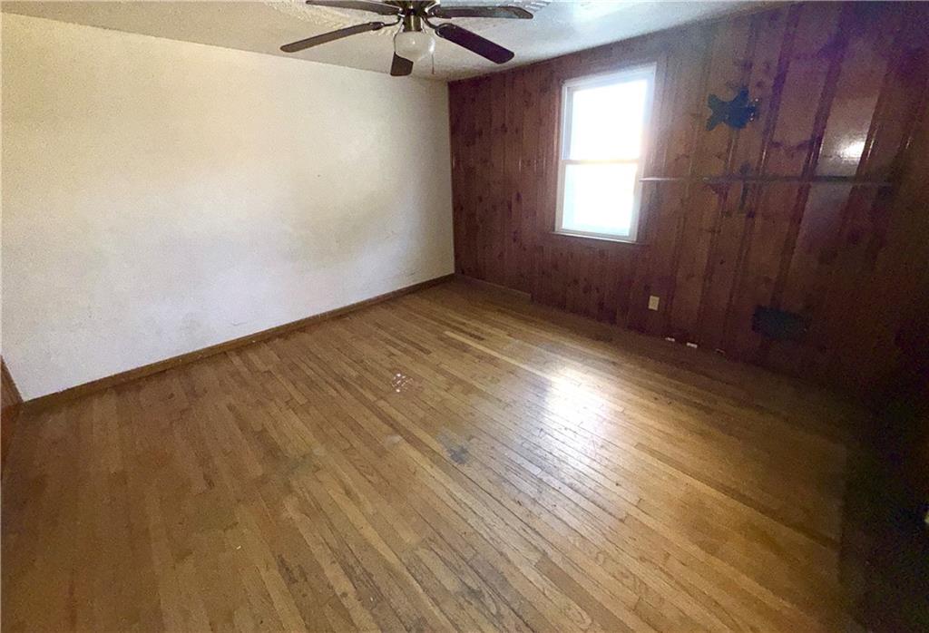 283 Line Street Central City, PA 15926 - Photo 5 of 11 an empty room with windows and fan