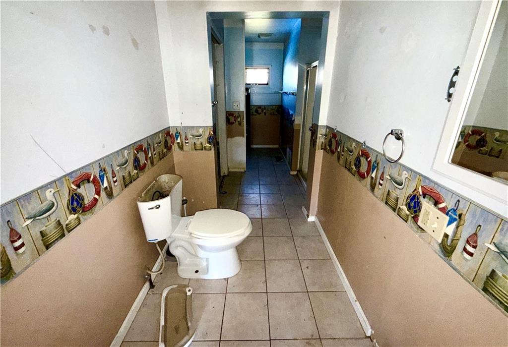 283 Line Street Central City, PA 15926 - Photo 6 of 11 a bathroom with a toilet and a mirror