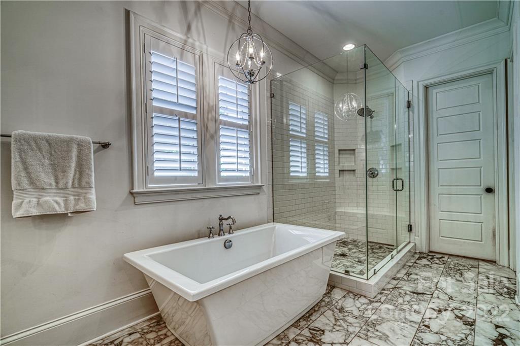 4026 Country Overlook Drive Fort Mill, SC 29715 - Photo 14 of 43 a bathroom with a tub sink and shower