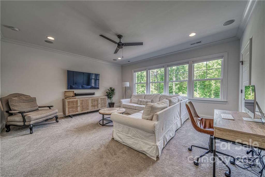 4026 Country Overlook Drive Fort Mill, SC 29715 - Photo 27 of 43 a living room with furniture and a flat screen tv