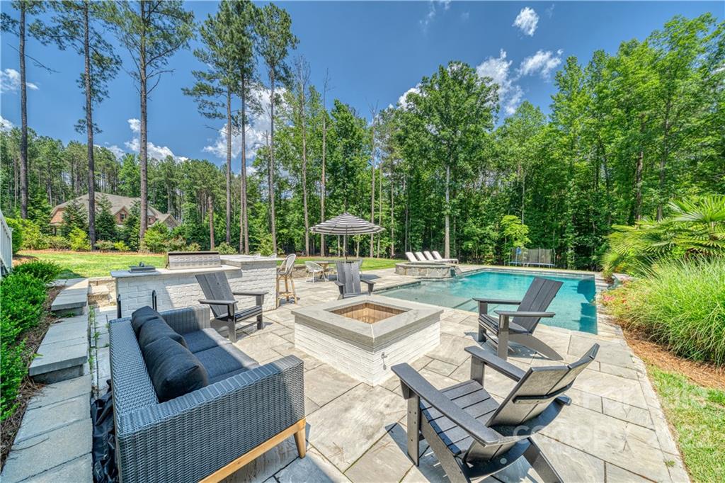 4026 Country Overlook Drive Fort Mill, SC 29715 - Photo 38 of 43 a view of a patio with couches chairs and a fire pit